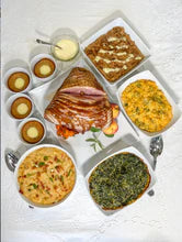 Family-style spread of Cajun turkey with sides