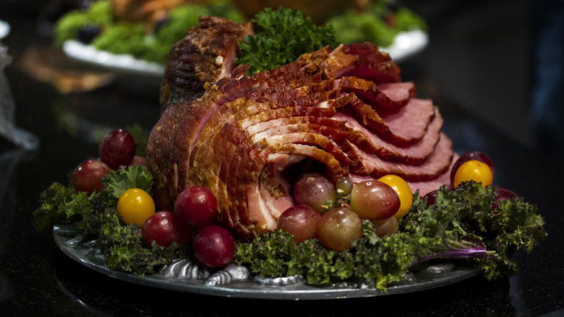 Carved Cajun turkey, steam rising at the holiday table
