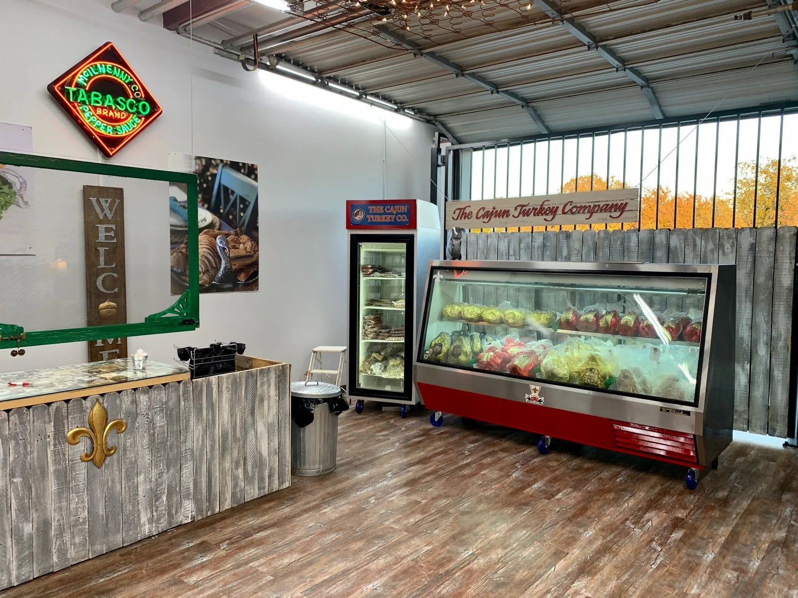 Deli case and welcome counter inside the Cajun Turkey Company store