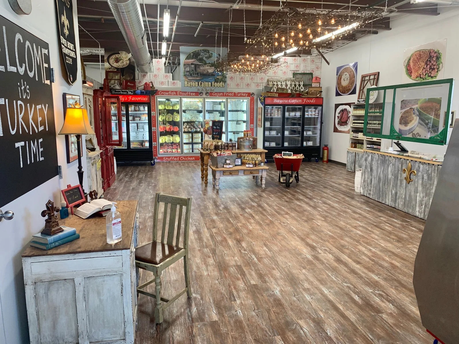 Open showroom floor with welcome chalkboard and coolers